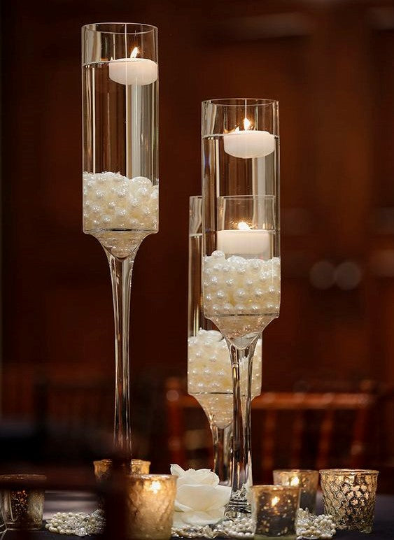 Lot de 12 bougies flottantes en ivoire de 3,8 cm, non parfumées.